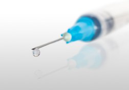 Syringe needle with a drop at the end